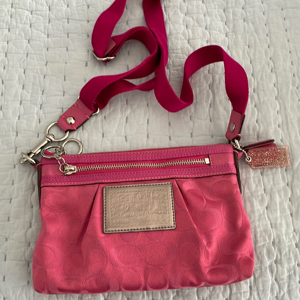 Coach pink crossbody. Like new.  Never used.  9 x 6 x 1